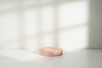 Fototapeta na wymiar Minimalist pink podium in room with window shadow
