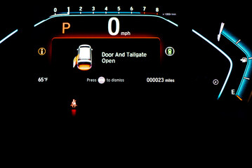 Left sliding rear door open warning on instrument panel or dashboard control of modern minivan car,...