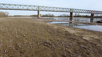 Europe, Italy, Pavia  Drought and aridity river - Po and Ticino , dry beach of sand and water shortage, water emergency in Lombardy - Drone view in Ponte della Becca - Climate change global warming