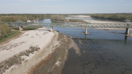 Europe, Italy, Pavia  Drought and aridity river - Po and Ticino , dry beach of sand and water shortage, water emergency in Lombardy - Drone view in Ponte della Becca - Climate change global warming