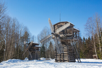Fototapeta na wymiar Wooden windmill in Malye Korely, Arkhangelsk region, Russia