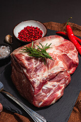 Raw pork loin with spices and herbs. Fresh meat cut, ingredient for cooking protein food