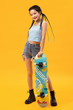 Personality young girl and skateboarding