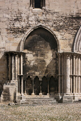 Blind arch with early gothic columns at the unfinished cathedral facade of Halberstadt in Germany