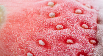 Frozen strawberries in chocolate. frozen red strawberries, close up. frozen background