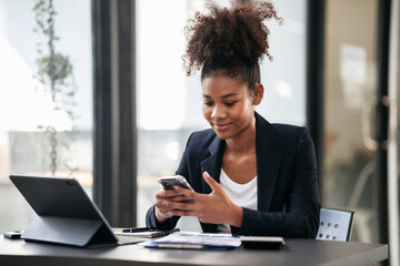 African american businesswoman in suit reading accounting inform