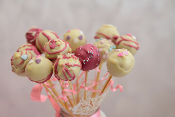 Closeup shot of colorful delicious frosted cakepops © Ervin Salgo/Wirestock Creators