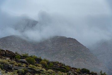 Swartberg Mountains in wild and windy overcast conditions. Near Klaarstroom and De Rust. Western Cape. South Africa
