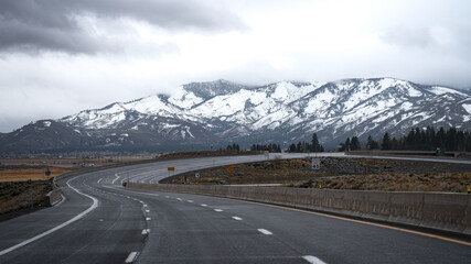 Scenic view of Old US Highway 395 with snowy mountains in distance. in Washoe Valley, Nevada
