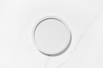 Beauty cosmetics product presentation flat lay mockup scene with white circle shape on white marble...