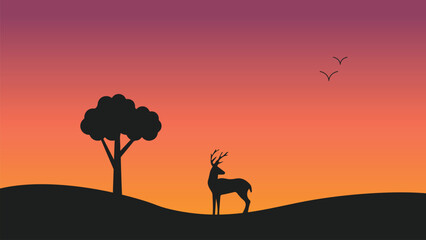 Fototapeta na wymiar silhouette of a deer at sunset with tree jungle and birds nature wallpaper for computer desktop