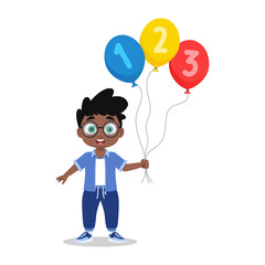 Cute boy holding number balloons