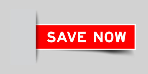 Red color square label sticker with word save now that inserted in gray background