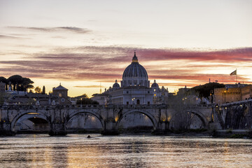 Fototapeta na wymiar 4K in movement of Majestic sunset landscape of Rome, Italy, featuring the Ponte Sant'Angelo, the river Tiber, and St Peter's Basilica in the Vatican. Amazing light cloud sky and Clouds move