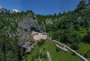 Predjama Castle in Slovenia, Europe. Renaissance castle built within a cave mouth in south central...