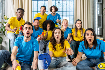 Friends sports fans gathered at home while watching the game of their quartering, moment of tension and concern