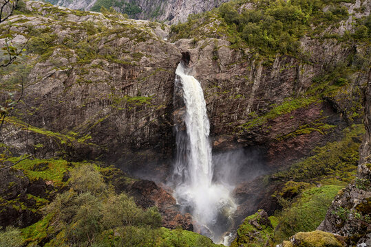 Waterfall in Norway with Mountains. Manafossen