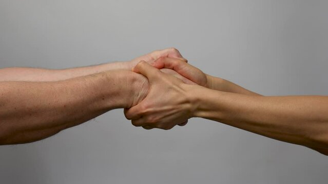 Man and woman greeting. Male and female handshake