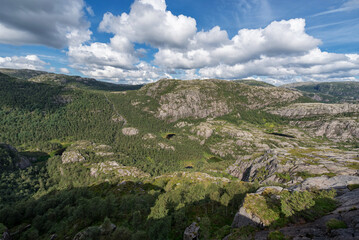Fototapeta na wymiar Norway Landscape. Close To Preikestolen Sightseeing Place. Mountains, Blue Sky.