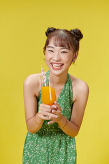Summer portrait of happy smiling young woman drinking fresh juice