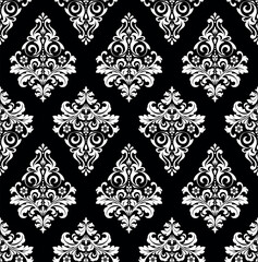 Floral pattern. Vintage wallpaper in the Baroque style. Seamless vector background. White and black ornament for fabric, wallpaper, packaging. Ornate Damask flower ornament