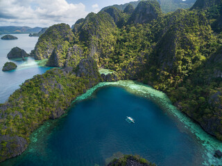 Single Boat in Coron, Palawan, Philippines. Sea and Mountain with Islands in Background
