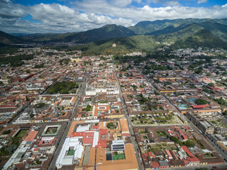 Antigua Cityscape. Spanish Baroque Style Town in Guatemala. Mountains in Background.