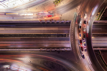 Expressway top view, Road traffic an important infrastructure, Drone aerial view fly in circle, traffic transportation, Public transport or commuter city life concept of economic and energ, transport.