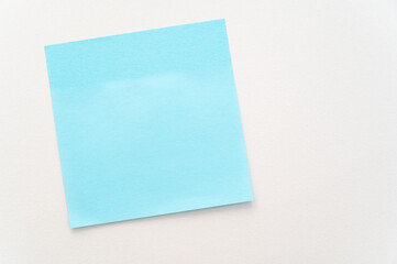 Post it of various colors stuck to a white surface. Notes and memos.
