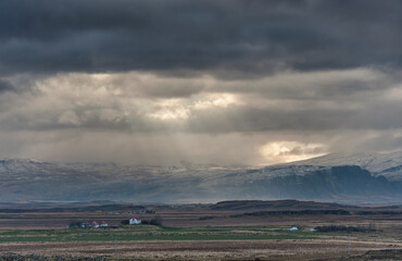 Iceland Landscape with Cloudy Sky and Sunlight.
