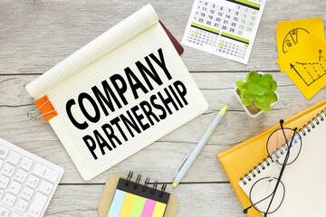company partnership. multicolored stickers and yellow notepad with notepad page with text