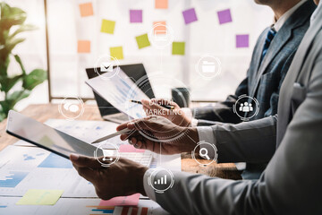 Business team to calculate financial information to invest in new projects. financial manager meeting.euing Smart phone and laptop and digital tablet PCs in office.