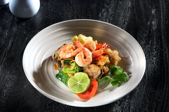 Close up view of nice yummy tempura shrimps on dark grey back