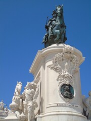 statue of monarch on the roof