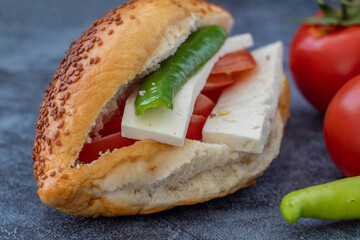 Izmir Kumru cold sandwich, tomato, pepper, cheese and sesame bread.