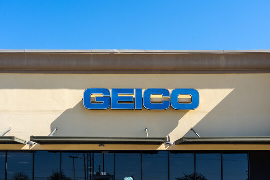 Texas, USA - March 12, 2022:  Close up of the GEICO sign on the building at one of its branches. GEICO is a private American auto insurance company.