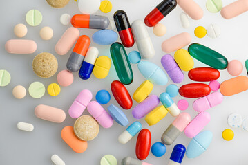 capsules tablets pill on white table. light shiny to blister pack of the capsules