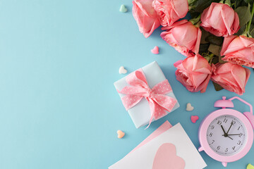 Mother Day gift concept. Top view photo of present box postcard  bouquet of pink roses alarm clock and small hearts baubles on pastel blue background with copy space