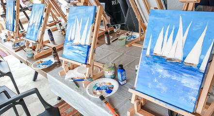 Turkey Marmaris 01.04.2023 Painting masterclass. Art party in restaurant. Glass of wine. Aquarelle watercolor, acrylic paints. Beginners class. Seascape nautical marine theme, sea boats, ships sails