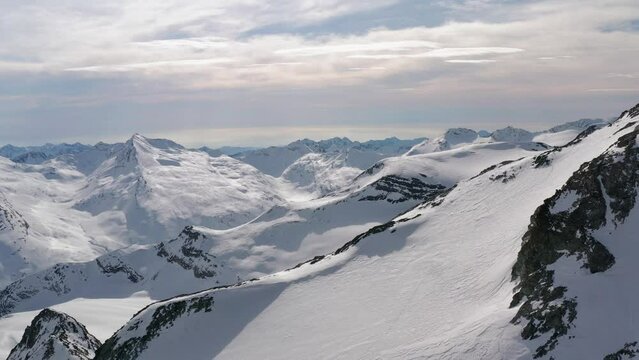aerial shots of swiss mountains in winter time