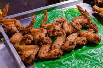 Traditional Thai chicken kebabs. Delicious grilled chicken wings in a special sauce