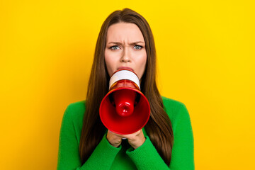 Photo of unsatisfied girl hands hold loudspeaker communicate isolated on yellow color background