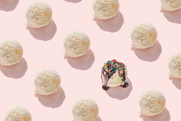 trendy seamless pattern of ice cream scoops and covered, strewed sprinkles and poured with chocolate icing on pink background, creative decoration