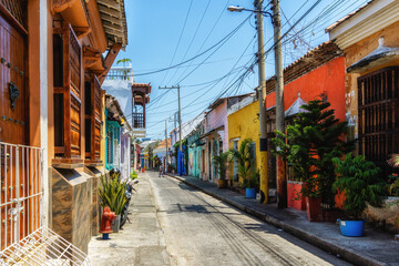 Fototapeta na wymiar Scenic colorful streets of Cartagena in historic Getsemani district.
