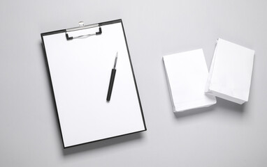 Clipboard with Two white packs mockup on gray background. Template for design. Business concept. Food delivery