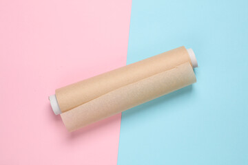 cooking paper roll on pink blue background