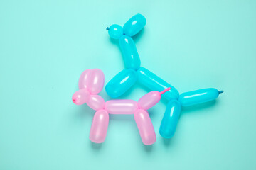 Dog balloons have sex on a blue background