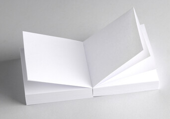 White blank square memo papers on gray background
