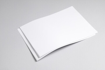 A4 white blank sheets of paper on a gray background. Template for design