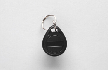 Plastic magnetic key on gray background